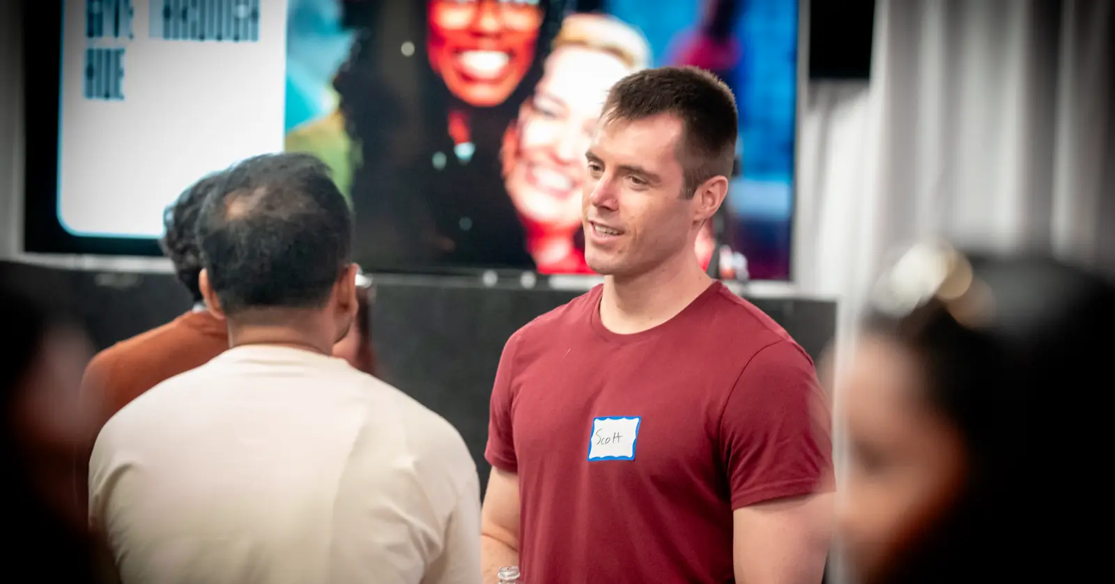 A guest getting a name tag at Hue.Church before Sunday service