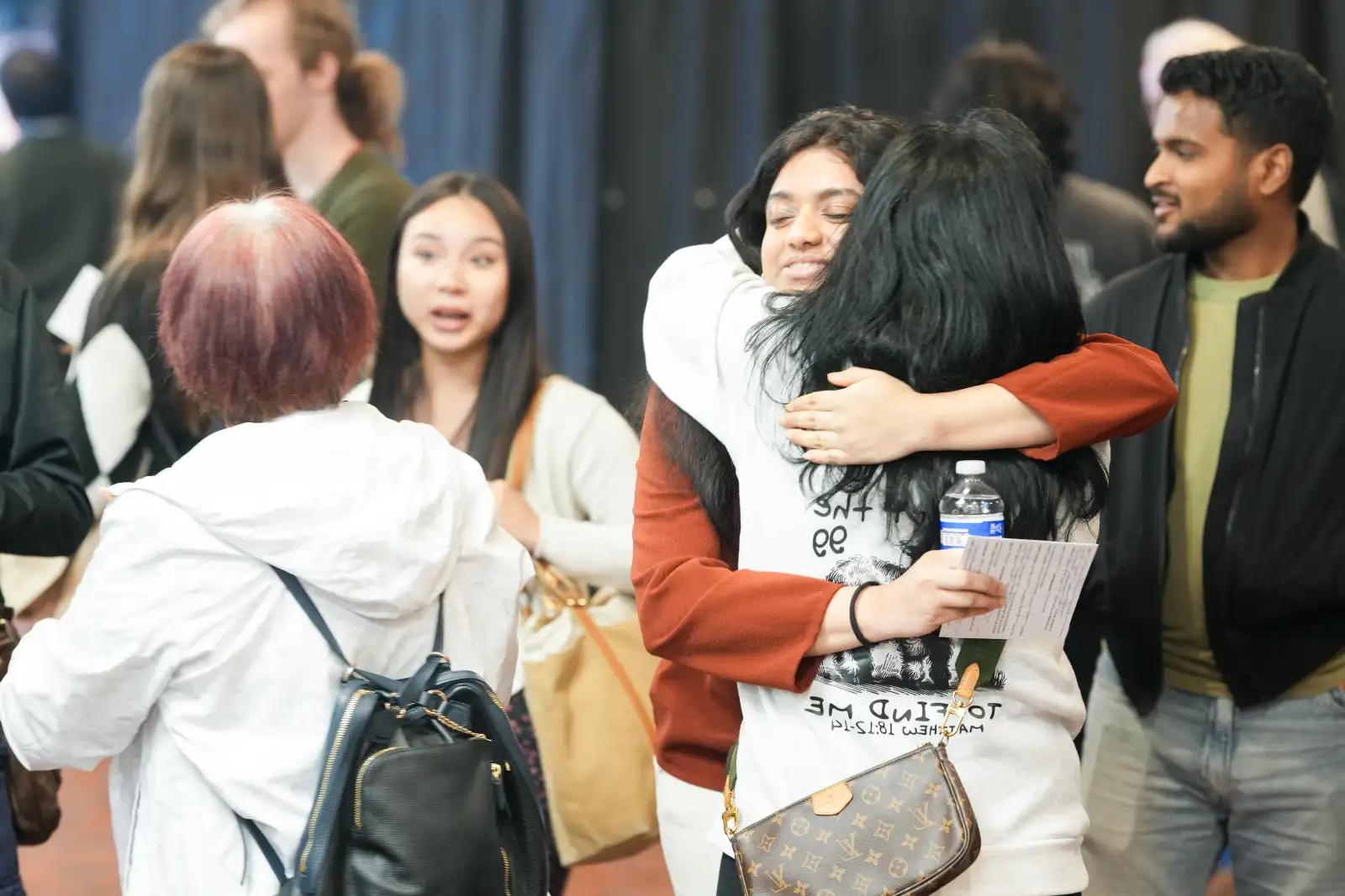 People hugging after Sunday service at Hue.Church Santa Clara